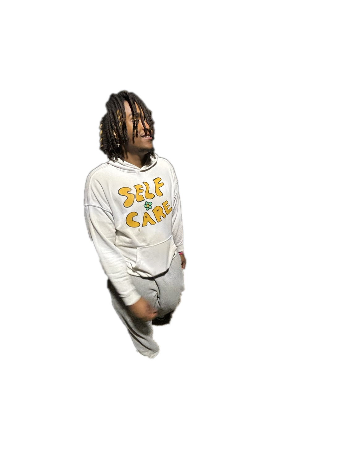 TTYL Rocky smiling in a white SELF CARE hoodie